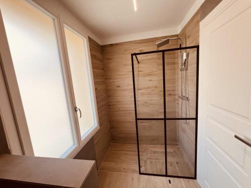 a shower with a glass door in a bathroom at 5 Terre Hub Suite 1 in La Spezia