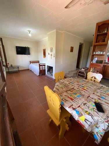 a bedroom with a bed and a living room at Casa Cadillal in El Cadillal