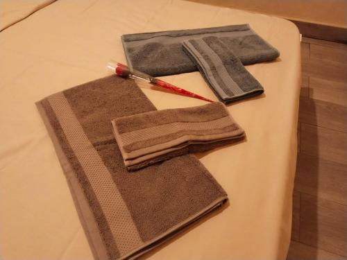 a pair of towels on a cutting board with a knife at Casa rural Cerro Campón in Carmona