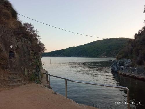 a view of a body of water with a mountain at Hippocampus House in Stratónion