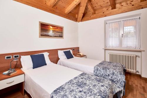 Postel nebo postele na pokoji v ubytování Bella Villa Apartments
