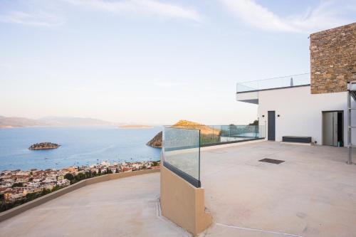 a house with a view of the water at Panoramic Villa in Tolo