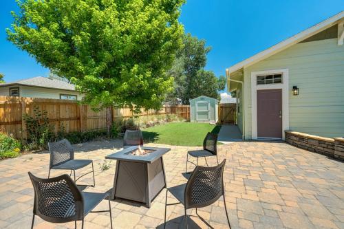 a patio with chairs and a table in a yard at Vista Montana Downtown Monument w BBQ & Fire Pit in Monument