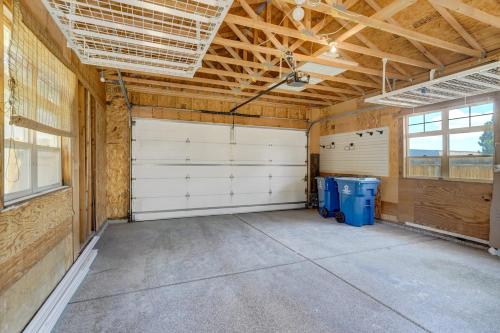 a large garage with two white garage doors at Vista Montana Downtown Monument w BBQ & Fire Pit in Monument
