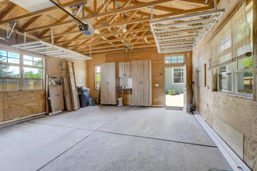 a large empty room with wooden walls and ceilings at Vista Montana Downtown Monument w BBQ & Fire Pit in Monument