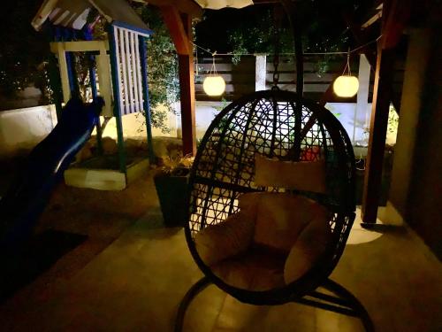 a tennis racket sitting on a slide in a house at House between beaches in Vir