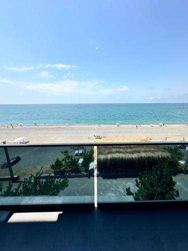 a view of the beach from the balcony of a condo at Hotel black sea in K'obulet'i
