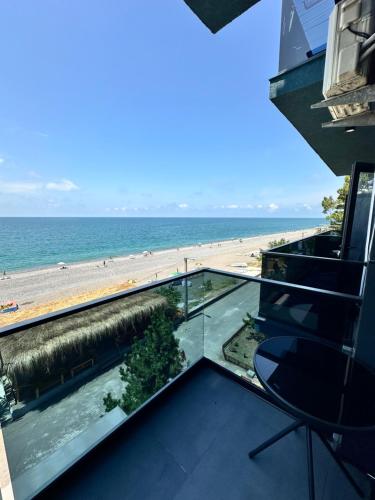 a balcony with a view of the beach at Hotel black sea in K'obulet'i