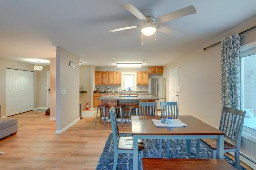 a dining room and kitchen with a table and chairs at Lakefront Fairbanks Home with Private Beach! in Fairbanks