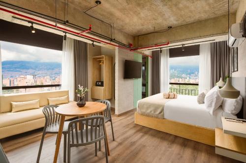Postel nebo postele na pokoji v ubytování Urbit Social Lofts