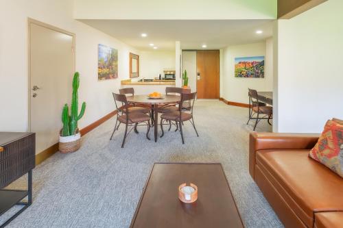 a living room with a couch and a table at Ventana Canyon Club and Lodge in Tucson