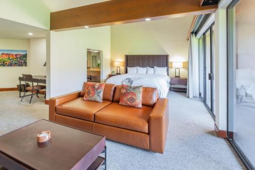 a hotel room with a bed and a couch at Ventana Canyon Club and Lodge in Tucson