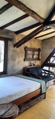 a bedroom with two beds in a room at Hoguera del Nómada in Santo Domingo