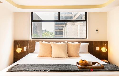 Cama o camas de una habitación en Grand Chapultepec by Kukun