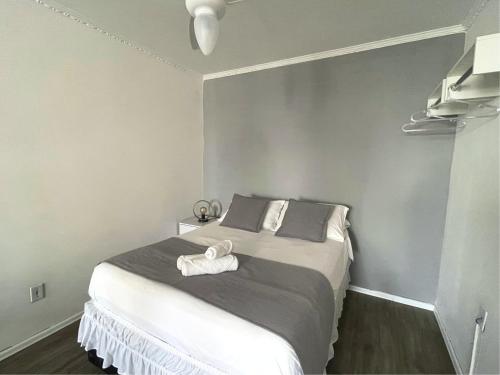 Ένα ή περισσότερα κρεβάτια σε δωμάτιο στο Apartamentos Liberdade São Paulo Center