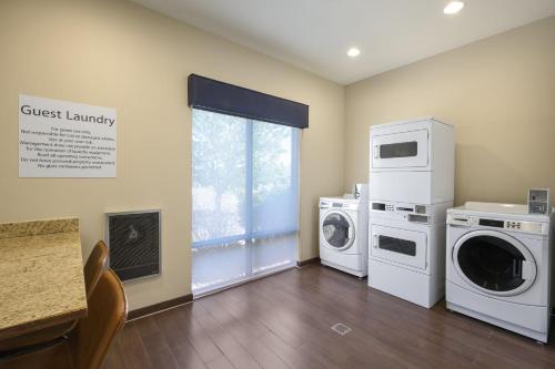a laundry room with a washer and dryer at Holiday Inn Express Belgrade-Bozeman Area by IHG in Belgrade