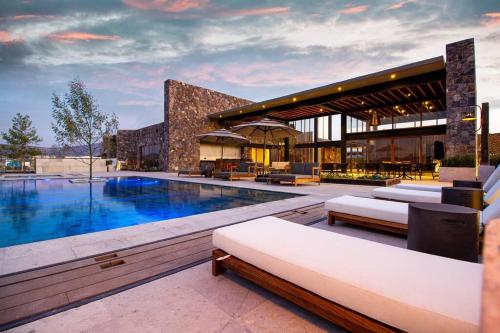 a resort with a swimming pool and a building at Exclusive Luxury Home with Rooftop Jacuzzi in San Miguel de Allende