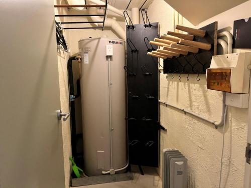 a room with a refrigerator in a room at Parkwood 5 - 2BR Split Level l Spa Bath l BBQ l Central Location l WiFi in Jindabyne
