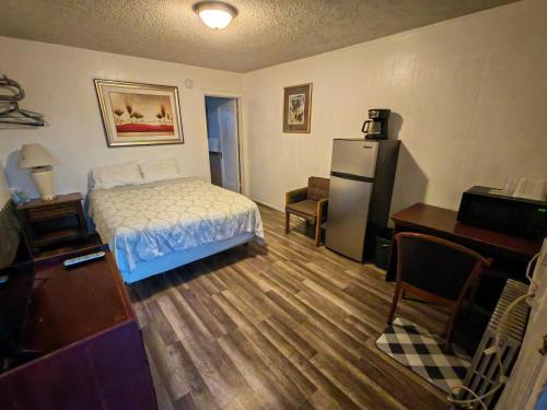 Postel nebo postele na pokoji v ubytování Cheyenne Motel