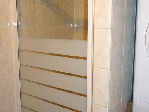 a shower with a glass door in a bathroom at Chalet rénové Les Gets 8 pers, central, 150m commerces, 350m pistes, terrasse sud, parking privé - FR-1-802-84 in Les Gets