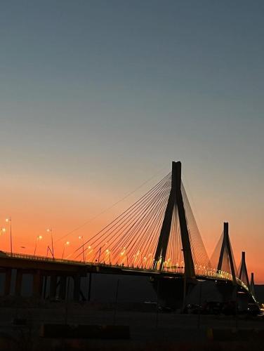 a bridge with a sunset in the background at no.21house studio apartment in Rio