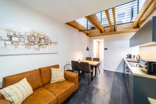 a living room with a couch and a table at CASTLE apartments - City Center in Spišské Podhradie