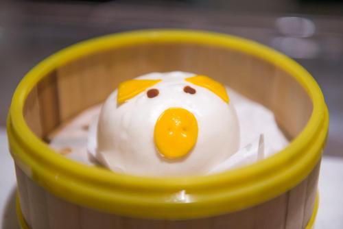 a toy duck in a basket with an egg at Atour Hotel Guangzhou Sanyuanli-Guangzhou Baiyun Railway-Fiee Self-Service Laundry in Guangzhou