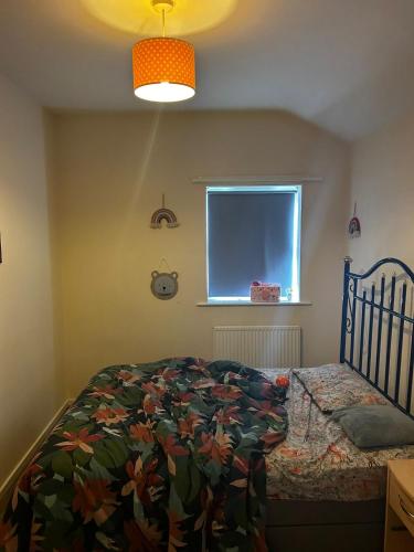 a bedroom with a bed and a window at Jakes holiday inn in Stockton-on-Tees