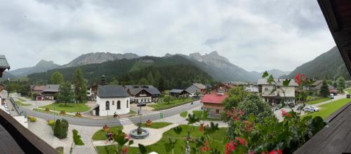 a view of a village with mountains in the background at Gästehaus Tauscher am Haldensee in Haldensee