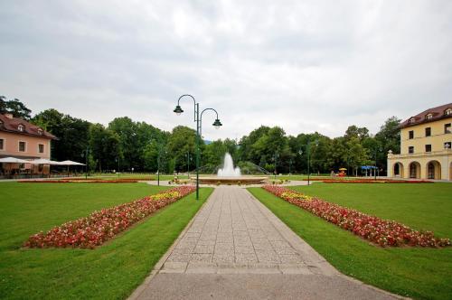 a park with a fountain in the middle of a park at Air Urban in Sarajevo