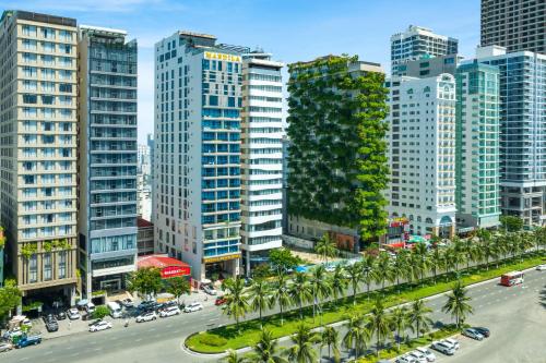 an aerial view of a city with tall buildings at Mandila Beach Hotel Danang in Da Nang