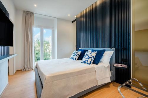 Postel nebo postele na pokoji v ubytování Infinito Luxury Suite