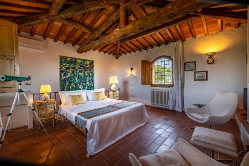 a bedroom with a large bed in a room at Villa dei Pavoni - Holiday Villa in Montauto