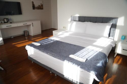 Postel nebo postele na pokoji v ubytování VE HOTELS KAPADOKYA