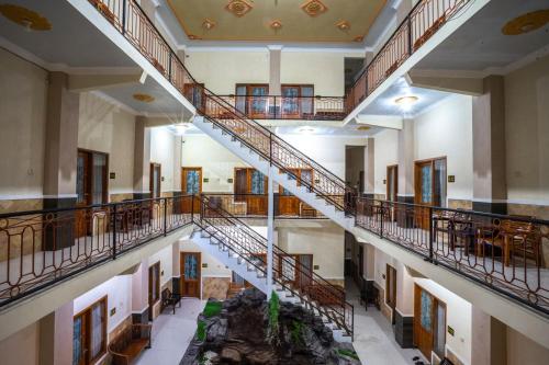 an overhead view of a large building with stairs at Grand Valonia Hotel Cafe & Park Jember in Jember