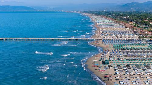 an aerial view of a beach with a pier at La Casa sul Forte in Seravezza