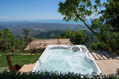 a jacuzzi tub sitting on top of a hill at La Casa sul Forte in Seravezza