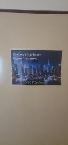 a picture of a sign on a wall at VIBE SPOLETO, Stazione a 150 mt, parcheggio gratuito in Spoleto