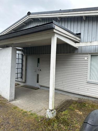 a garage with a pillar in front of it at Iiris in Imatra