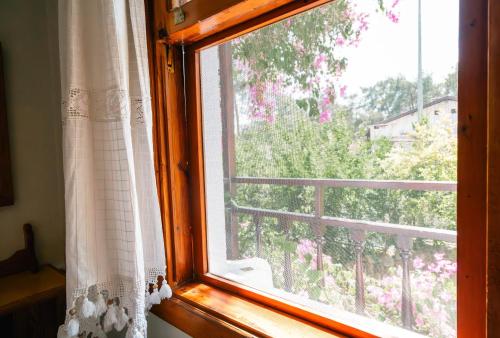 an open window with a view of a balcony at Totelya Hotel in Akyaka