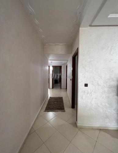 an empty hallway with white walls and a ceiling at Appartement Centre Ville in Kenitra