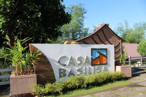 a sign for a casa sushi restaurant at Casa Basilisa Hotel & Resort in Guinobatan