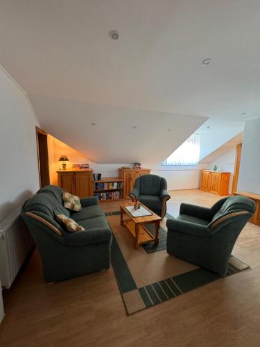 a living room with two chairs and a couch at Holiday home Ana in Fokovci