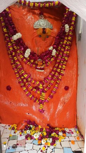 a cake shaped like a man with a crown on top at Abhiram Homestay in Khajurāho