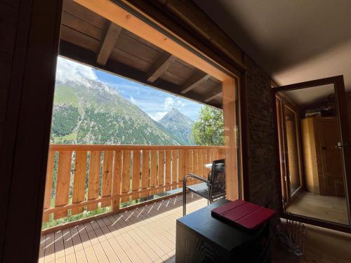 a balcony with a view of a mountain at Chalet TALBLICK - Luxurious Penthouse on the 1st floor! in Saas-Fee