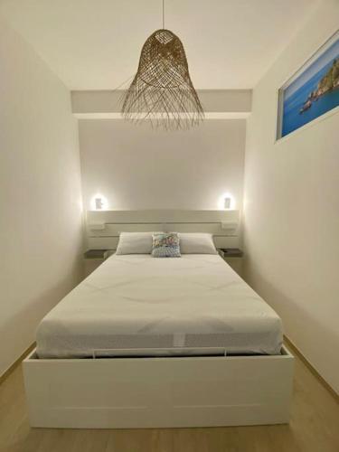 Ένα ή περισσότερα κρεβάτια σε δωμάτιο στο Sweet Home Naxos