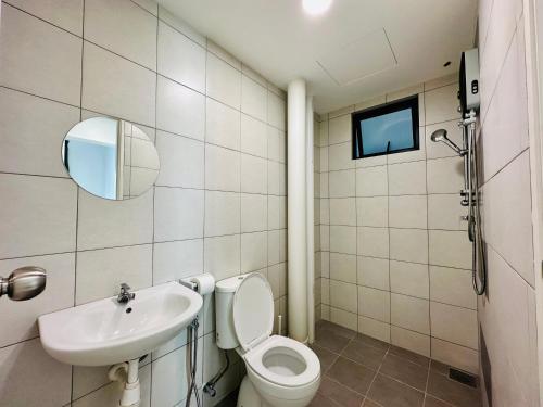 a bathroom with a toilet and a sink at The Sun 1 or 3BR Bayan Lepas 4 to 10 pax WL in Bayan Lepas