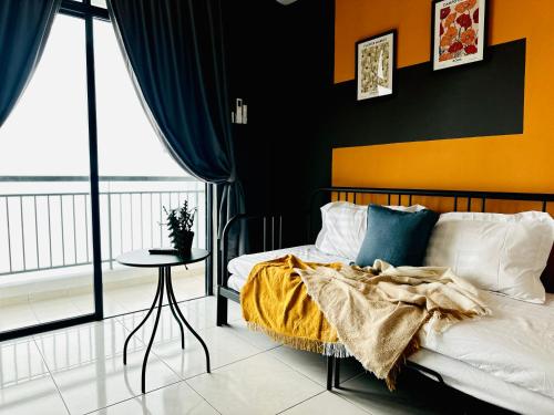 a bedroom with a bed with an orange and black wall at The Sun 1 or 3BR Bayan Lepas 4 to 10 pax WL in Bayan Lepas