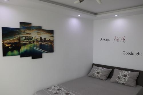 a couch in a room with a painting on the wall at Apartament Bianca in Năvodari