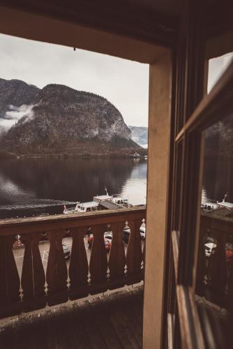 a view from a window of a river with boats at Heritage Hotel Hallstatt in Hallstatt